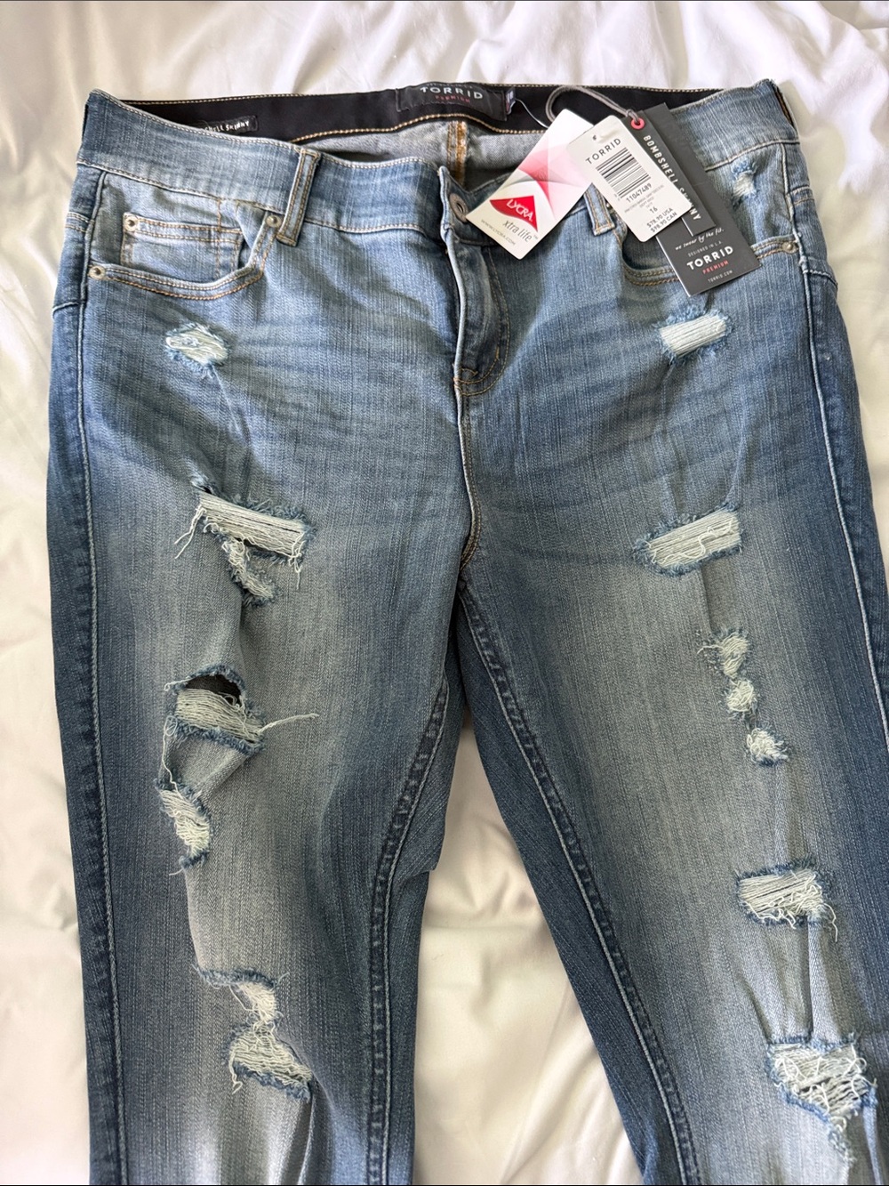 Torrid Bombshell skinnyLight Blue Distressed Skinny Jeans in 16 XS.